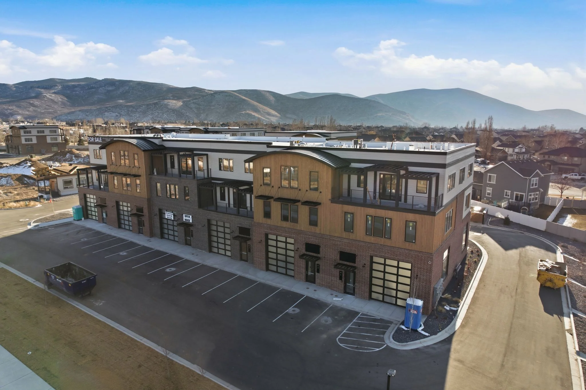 Aerial view of Mountain View Commons mixed-use development in Heber City, Utah, with the Wasatch Range in the background