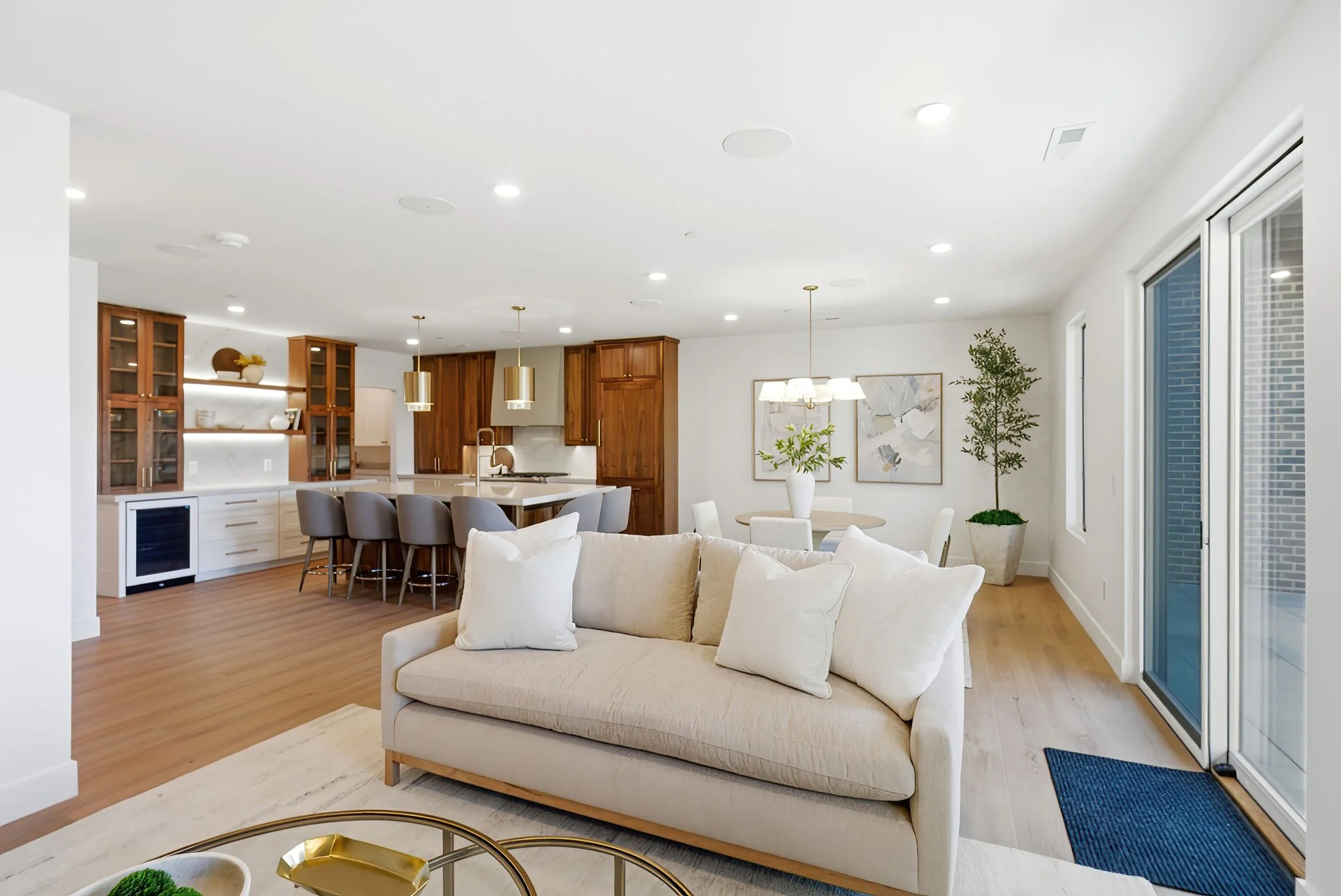 Great room with open dining area and floor-to-ceiling windows