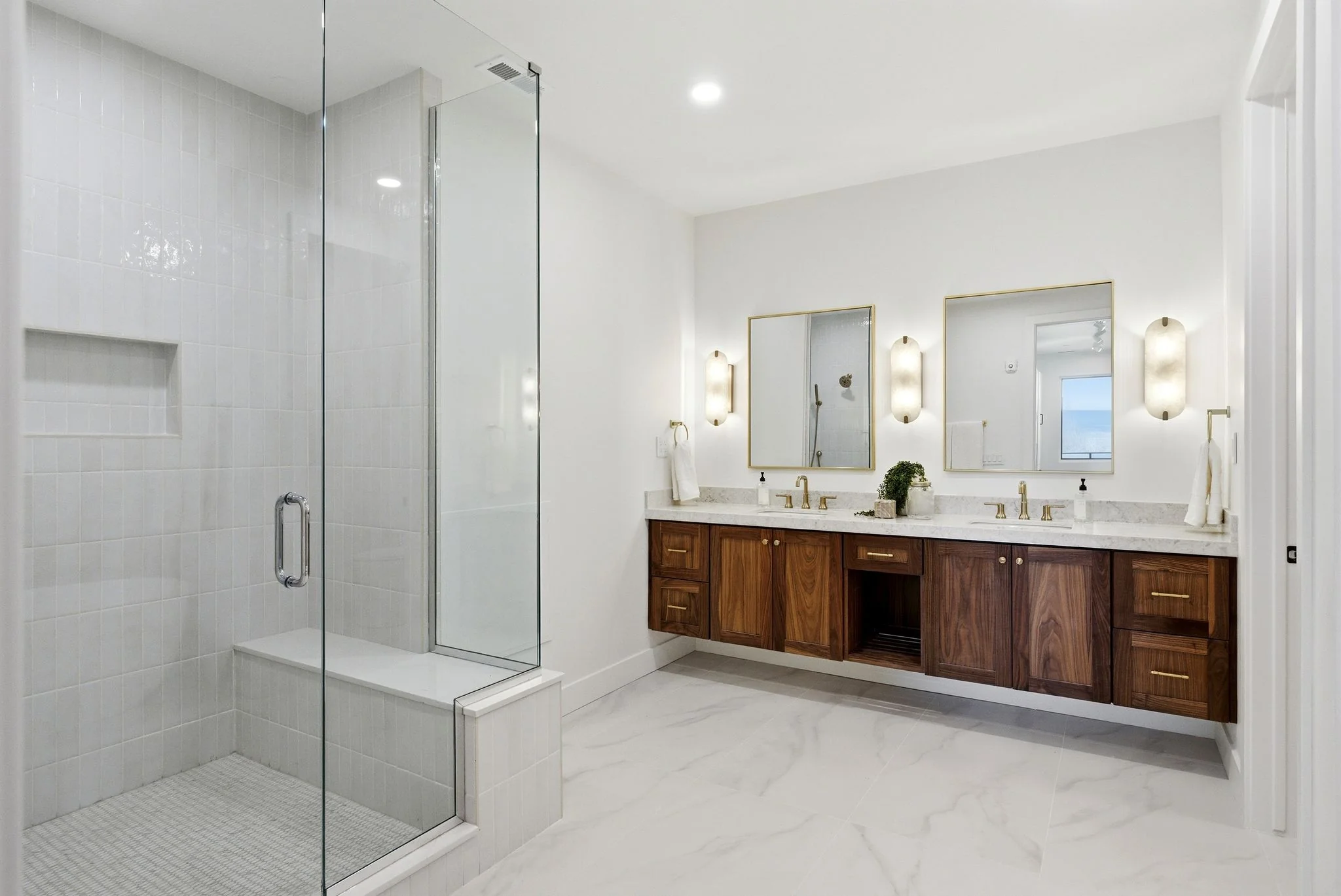 Walk-in shower with bench and rain head