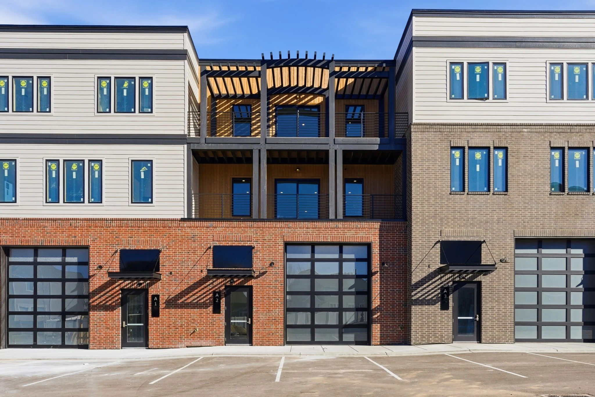 Mountain View Commons exterior, three mixed-use units fronting the parking lot